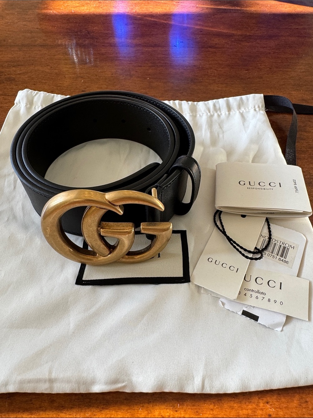 Gucci black leather belt with oversized gold Double G buckle
